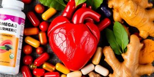 Heart with healthy supplements surrounding it.